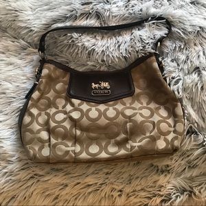 Tiny coach purse. Old but in good condition.